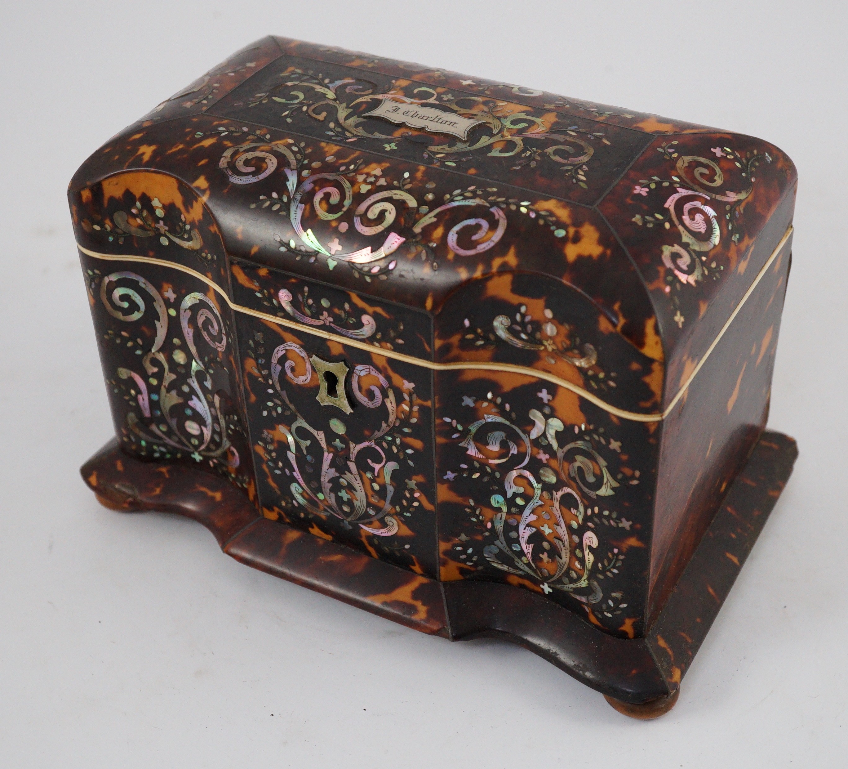 A Regency mother of pearl inset blond tortoiseshell tea caddy, 20cm wide 12.5cm deep 13.5cm high